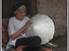 Woman making conical hat near Hanoi