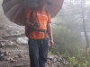 Tobgay with umbrella along trek
