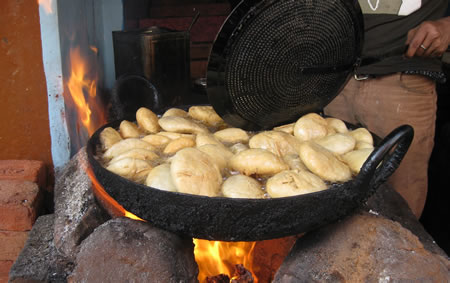 Vendor frying bread