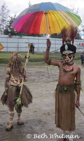 Enga tribe with umbrella in rain