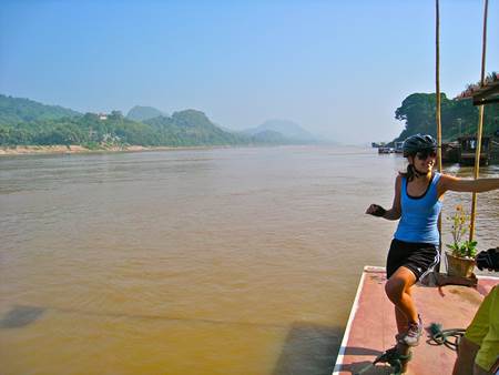 Woman Biker at Mekong Riverbank