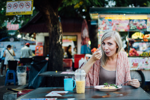 Alana eating Thai street food